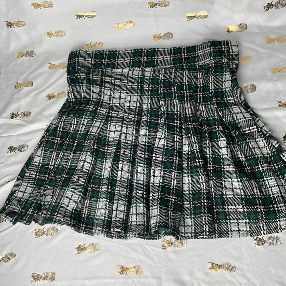 Pleated tennis mini skirt in green plaid